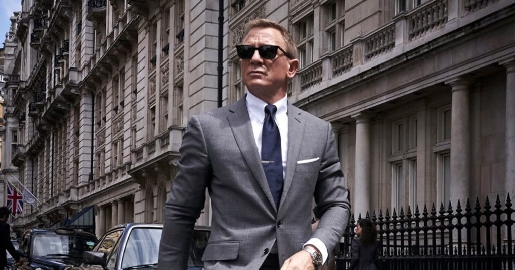 james bond walking down the street with sunglasses